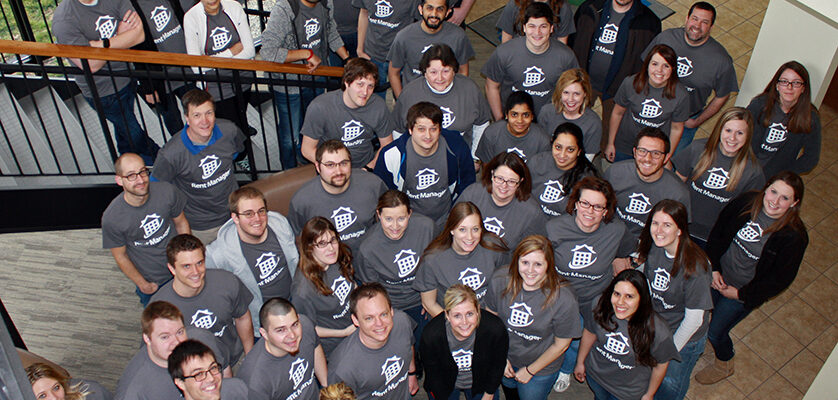 Group of LCS employees wearing LCS shirts pose for group photo
