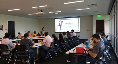 Corrin presenting at a lunch and learn