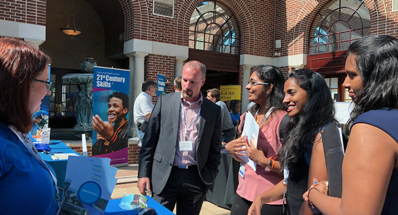 Rachel talking to students at job fair