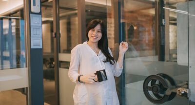 Woman knocking glass door