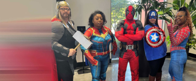 Employees dressed up at the Justice League