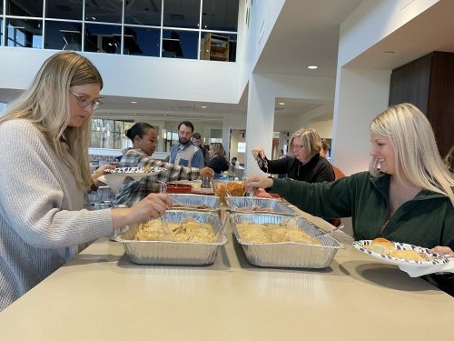 LCS Employees at the buffet line at the Thanksgiving Potluck