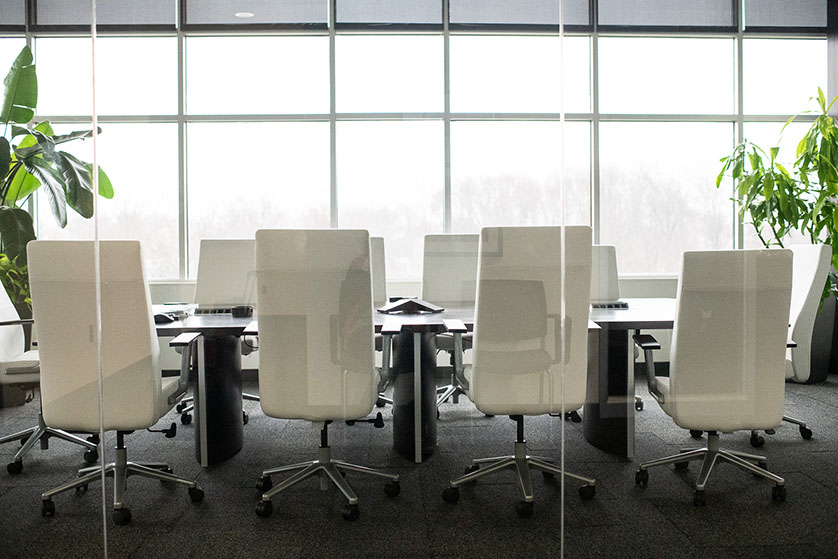 Corporate board room with white chairs