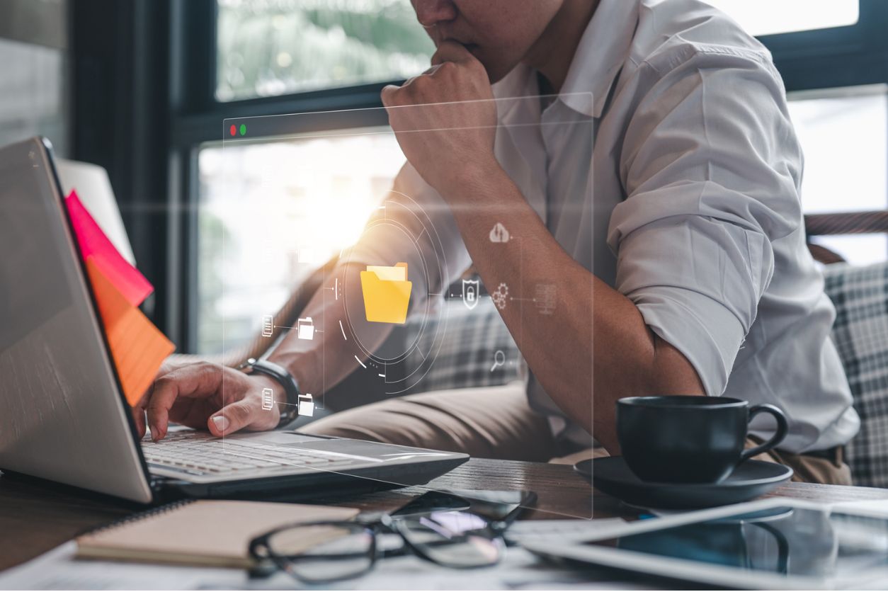 Man on laptop using file manager